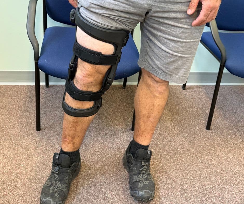 Patient wearing a custom knee brace at O&P Labs in Springfield, MA, designed to provide support, stability, and improved mobility.